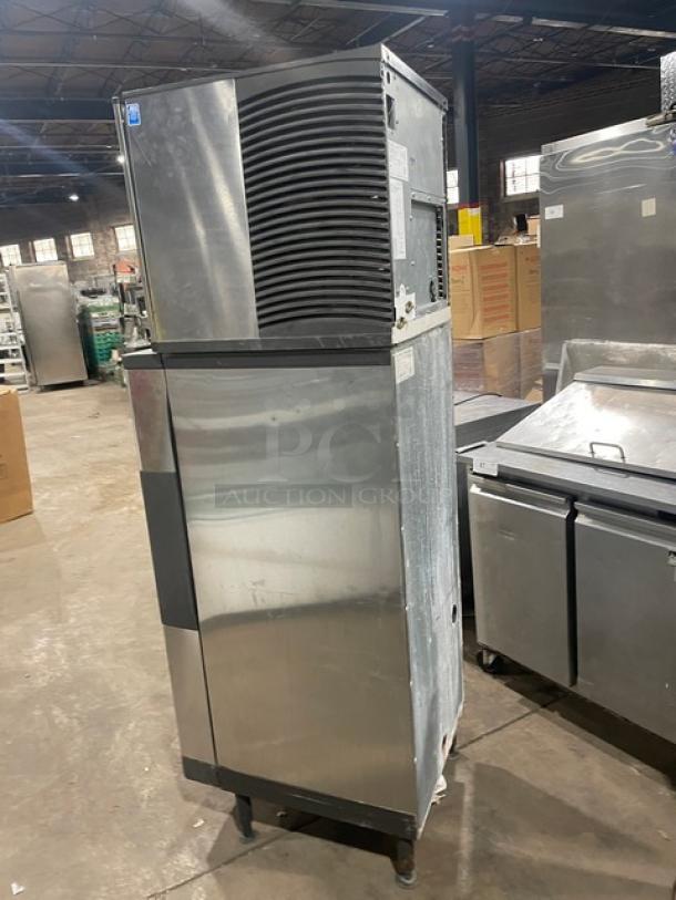 Manitowoc stainless steel water-cooled ice maker/dispenser, model SD0423W/QPA160, on legs, commercial use.