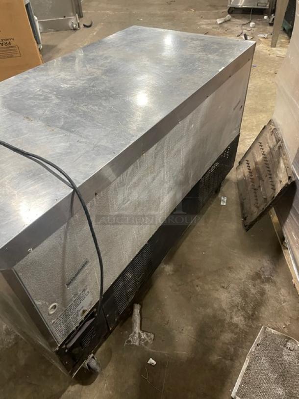 Avantco 2-door stainless steel 60" worktop refrigerator, model 178SSUC60RHC, on casters. Used condition, 115V, visible wiring.