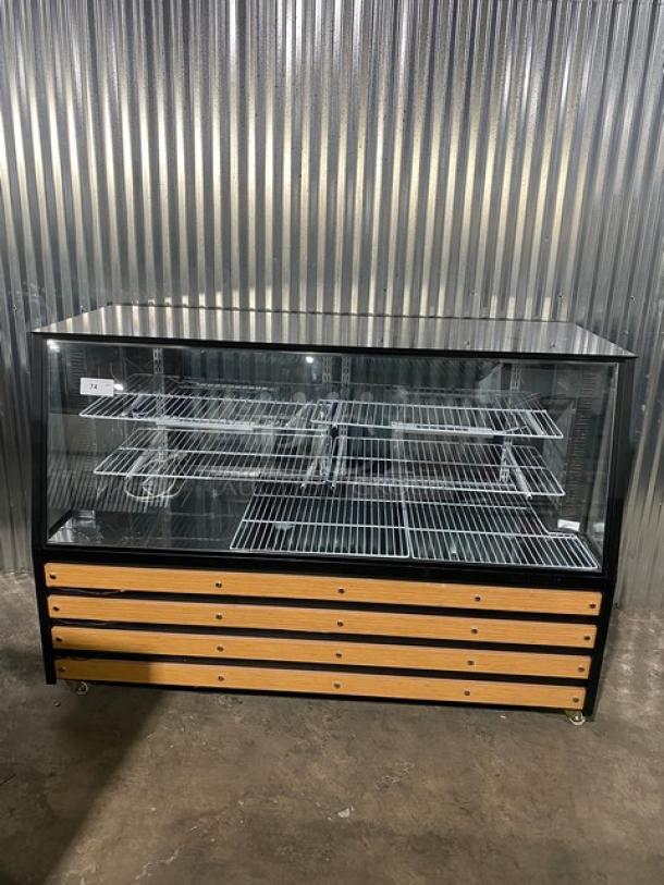 Commercial Black 72" refrigerated deli display with slanted glass, dual rear glass doors, poly coated racks, and casters.