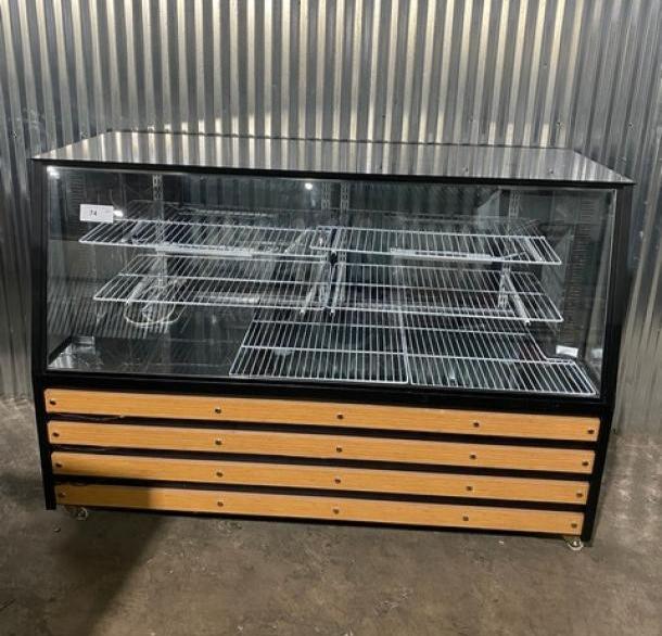 Commercial 72" black refrigerated deli display with slanted glass, poly coated racks, dual rear glass sliding doors, and storage.