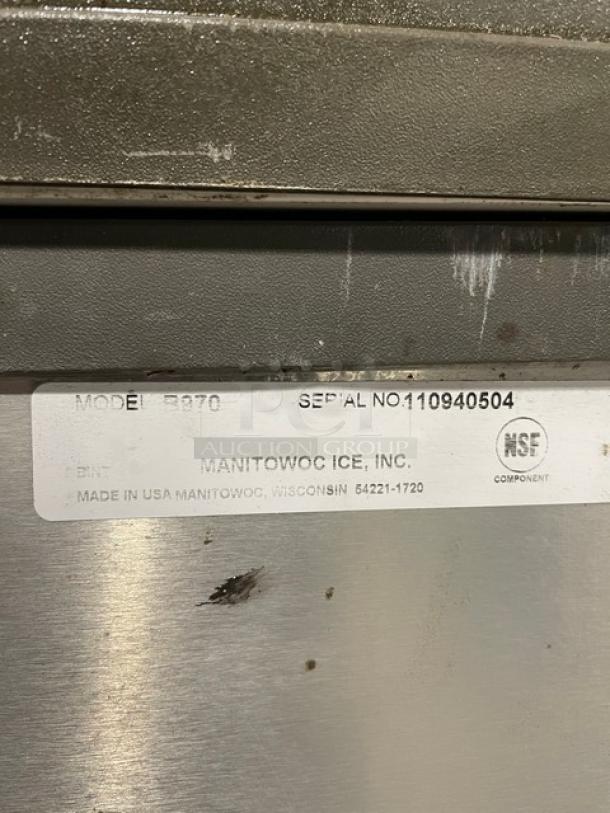Manitowoc SY1804A/B970 ice machine with lift-open lid, stainless steel, 208-230V, 1 phase, serial no. 110940504, on legs.