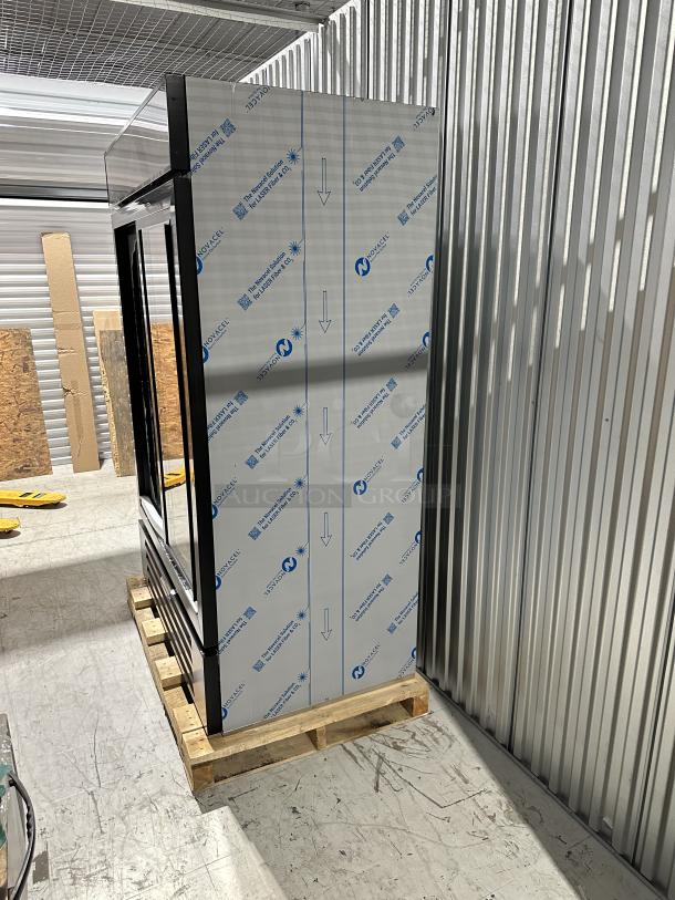 Beverage-Air 85MMR45HC1B MarketMax black fridge, scratch and dent, 52" two-section, partial packaging visible, on pallet.