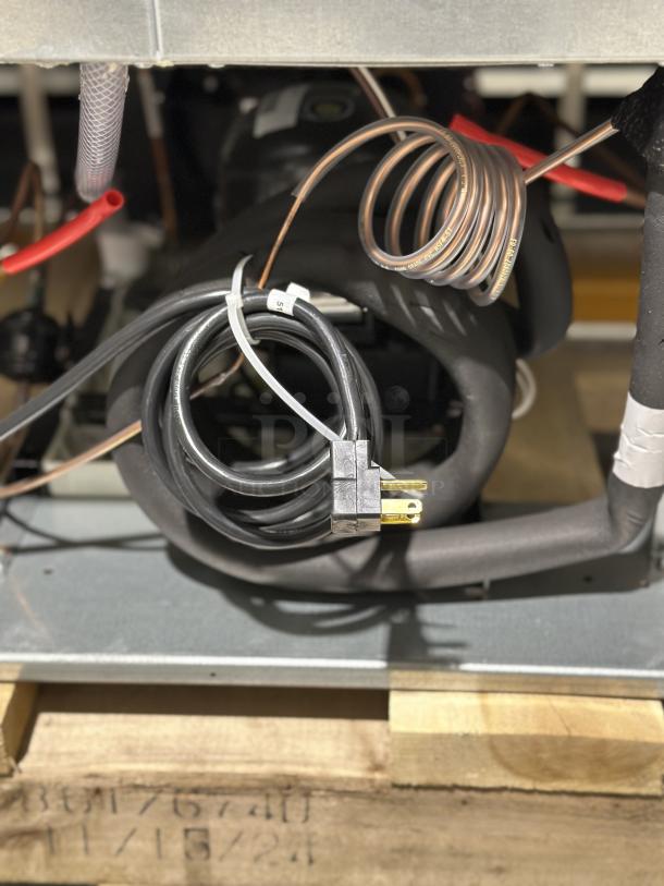 Electrical and cooling components of Beverage-Air MMR45HC-1-B refrigerator showing wiring and copper coils, new condition.