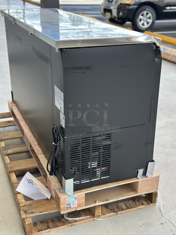 Avantco UBB-72S-HC back bar refrigerator on pallet. Black, 73", sliding glass door, visible edge damage. Serial 384160775.
