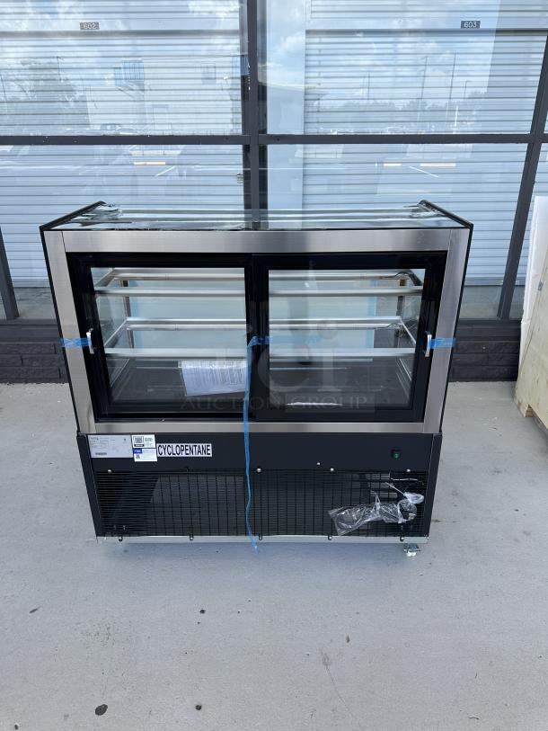 Avantco BCD-48 48" black dry bakery display case with curved glass, minor scratches, broken glass visible, 1 phase, 115V.