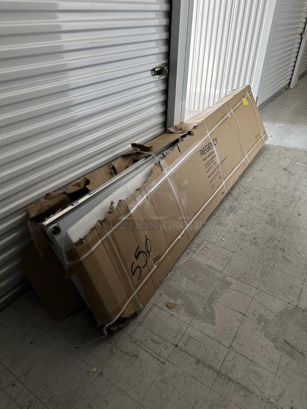 Regency 24"x120" stainless steel work table, new, 16-gauge, 4" backsplash, undershelf. Scratch and dent condition. Model 600TSB24120S.