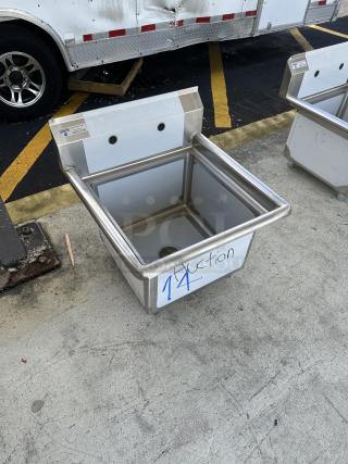 Steelton stainless steel commercial sink, brand new, minor scratches and dents, durable construction, auction label visible.