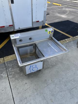 Regency sink component with right drainboard, brand new, scratch and dent condition, visible showroom labels.