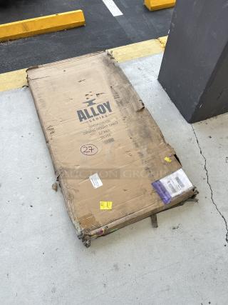 Brand new Alloy Silver Dining Table, model 164DA3263SIL, 32"x63", scratch and dent condition, packaging damaged.