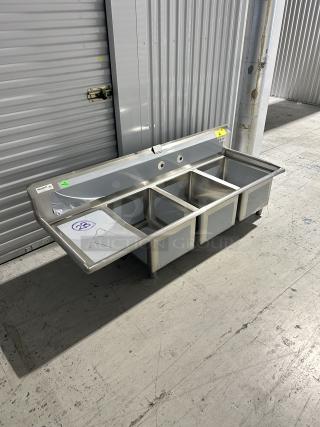 Brand new Regency 3-compartment sink model 600S3162018L with 16"x20"x18" bowls, left drainboard, minor scratches.