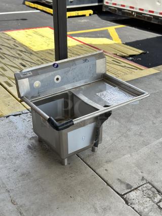 Brand new Regency sink component with right drainboard, model 600S1181818R, scratch and dent, stainless steel construction.