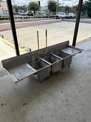 Regency 94" stainless steel three-compartment sink with 2 drainboards; scratch and dent condition; Model 600S31824224.