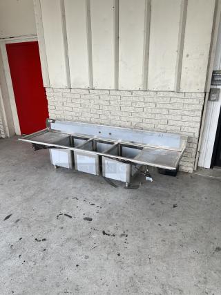 Brand new Regency 94" 16-gauge stainless steel 3-compartment sink, model 600S31824224, with 2 drainboards, scratch and dent condition.