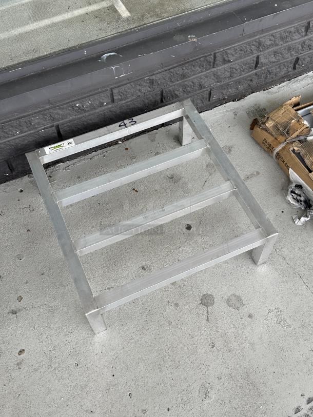 Regency 24"x24"x8" aluminum dunnage rack, model 600DUN24248, brand new with scratches, 1,500 lb capacity, visible label.