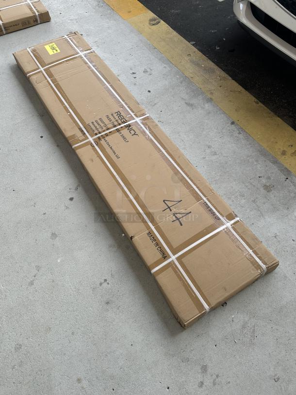 Brand new Regency 16-gauge stainless steel pass-through shelf in box, model 600PTS1884, 18" x 84", scratch and dent.