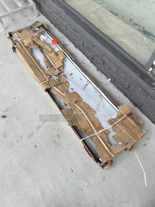 Regency 16-Gauge Stainless Steel Pass-Through Shelf, 18"x84", Model 600PTS1884, shown in damaged packaging.