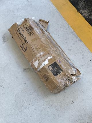 Brand new Steelton stainless steel double tier speed rail, 36", model 712B5536D, scratch and dent condition, in original packaging.
