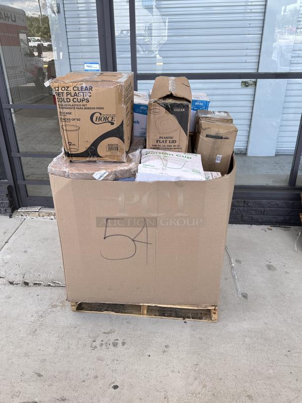 Mixed pallet with boxed items including 12 oz clear PET cold cups, plastic flat lids, and other disposables. Marked "54."
