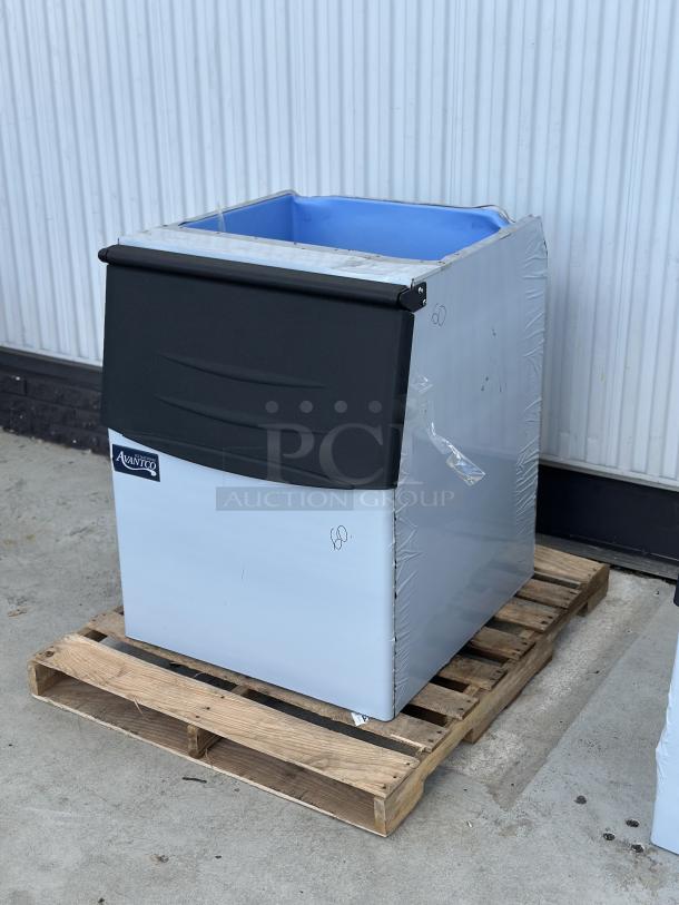 Avantco BIN27530 30" ice storage bin, 375 lb capacity, silver and black, on a pallet. Appears new with protective wrap.