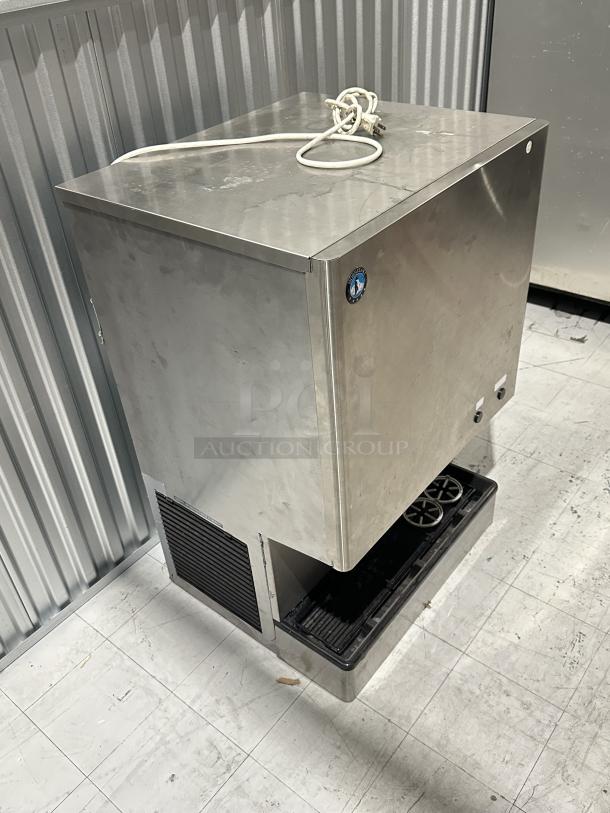 Used Hoshizaki DCM-300BAH ice maker, stainless steel, with visible serial number H23773K, power cord attached.