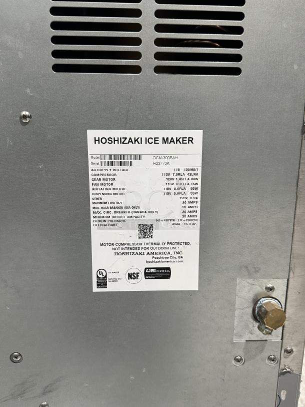 Used Hoshizaki Ice Maker, Model DCM-300BAH, Serial H23773K. Features technical specs label, UL and NSF certified.