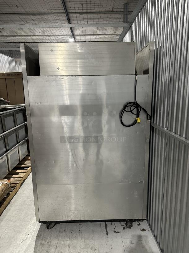 Used True Refrigerator, 2 sections, model 3025342. Stainless steel exterior with visible wear. Includes power cord.
