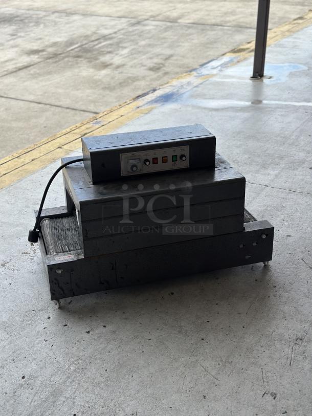Used conveyor toaster oven in fair condition with control panel and visible cord. Metal exterior with control buttons.