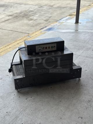 Used conveyor toaster oven in fair condition with control panel and visible cord. Metal exterior with control buttons.