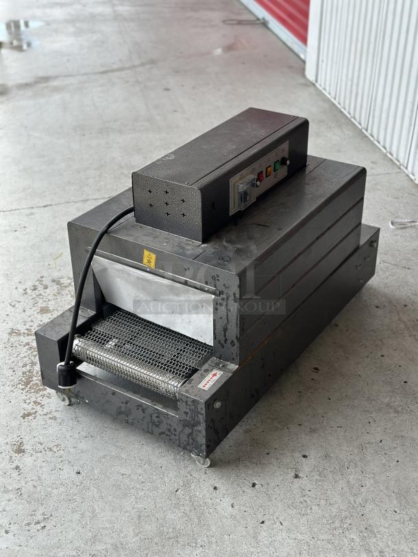 Used conveyor toaster oven with visible control panel, industrial design, and power cord. Shows signs of wear.