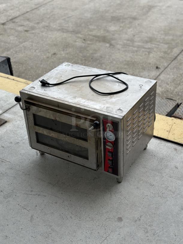 Used Avantco Double Deck Countertop Pizza/Bakery Oven, stainless steel, visible controls, and power cord; moderate wear.