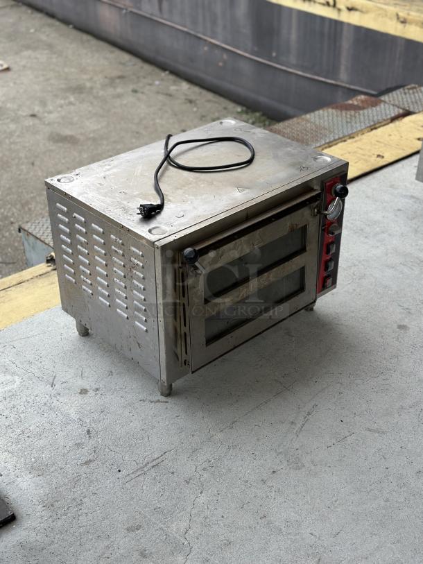 USED Avantco Double Deck Countertop Pizza/Bakery Oven; metallic finish, visible wear; power cord attached; control knobs on side.