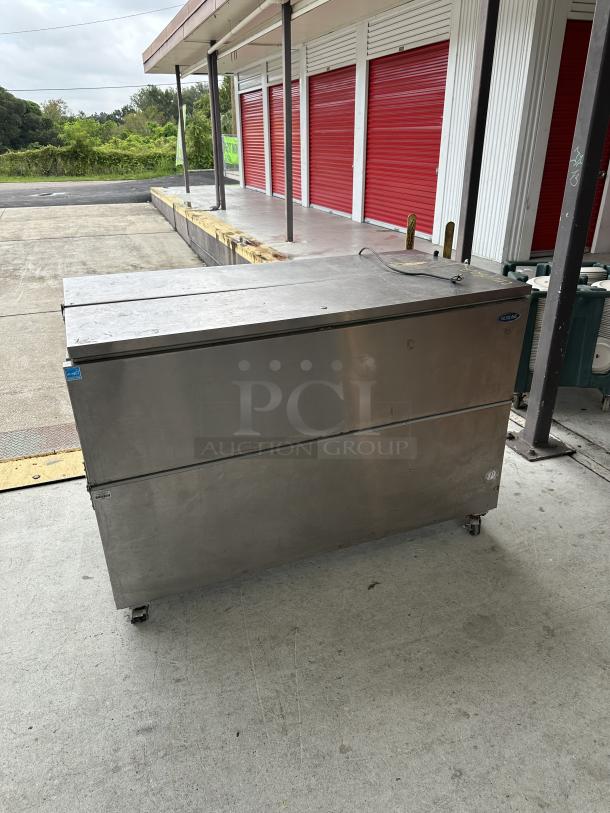 USED Norlake School Milk Cooler, stainless steel, on wheels, some surface wear, Norlake logo visible on the side.