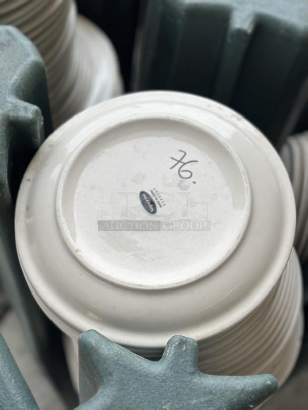 Used Superior ceramic plate, 9"-10", white with minor wear. Marked "76" on base.
