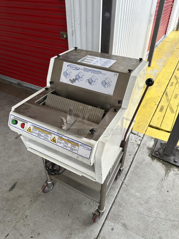 USED Oliver front load bread slicer with stand, visible control panel, and safety instructions. Good condition.