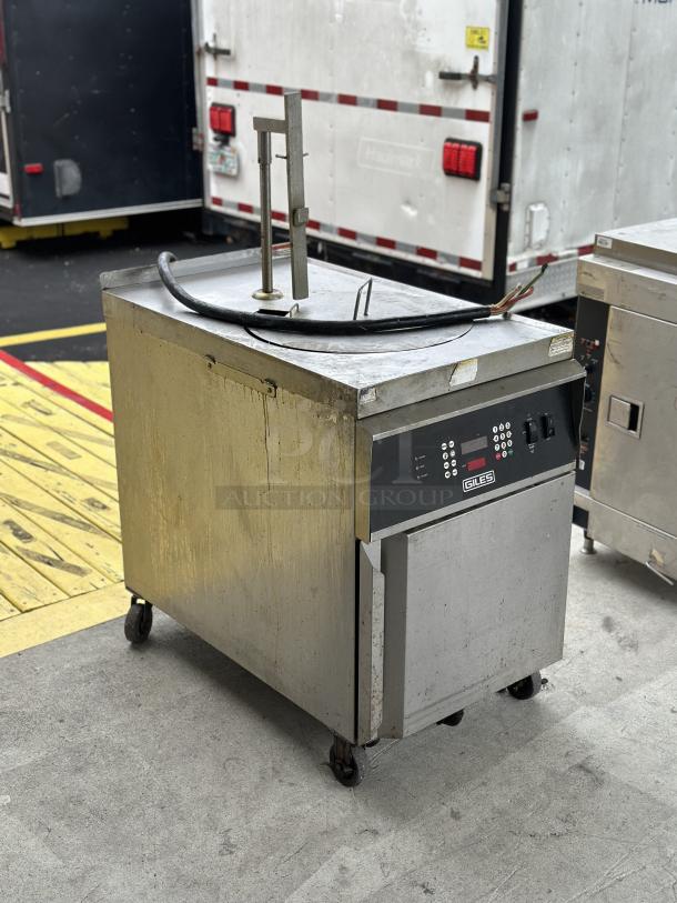 USED Giles electric fryer, stainless steel, visible wear, digital controls, on casters for mobility, industrial use.