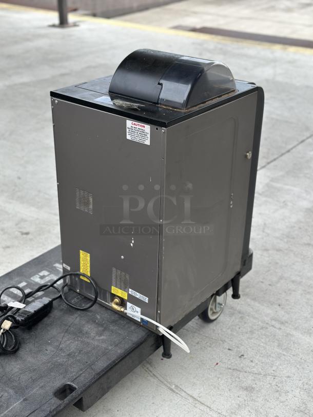 Used Krea Touch Necta coffee machine on a dolly, visible wires, caution label, and moderate wear.
