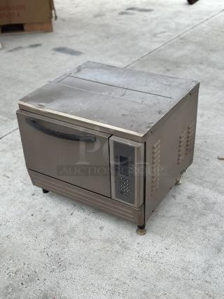 USED Turbochef oven, visible wear, digital control panel, sturdy handle, suitable for rapid cooking needs.