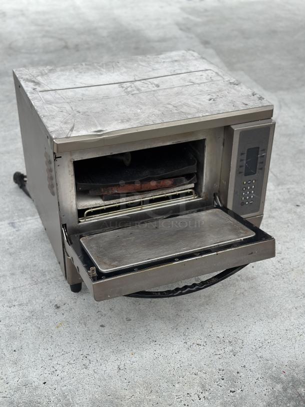 Used TurboChef oven, stainless steel, worn condition, digital control panel, interior racks visible.