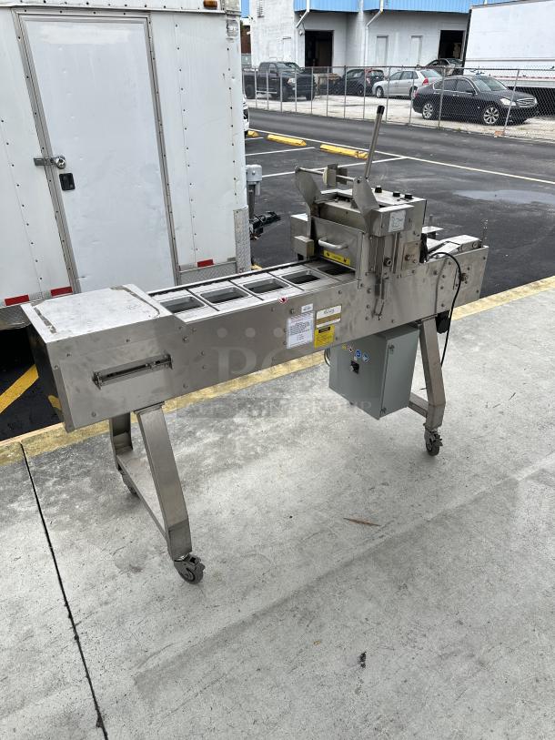 USED Oliver Speedseal MX 1808 Automated Packaging System, stainless steel, with control panel, on wheels, showing wear.