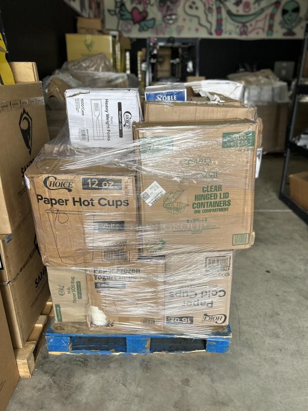 Mixed pallet of boxed items including paper hot cups, clear hinged lid containers, and heavy weight forks.