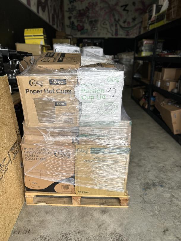 Mixed pallet of new packaged items including 10 oz paper hot cups, portion cup lids, and 16 oz plastic cold cups.