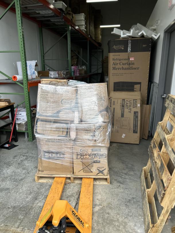 Mixed pallet of brand-new hot and cold drink cups, various sizes, packed in boxes, shrink-wrapped on a warehouse floor.