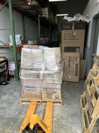 Mixed pallet of brand-new hot and cold drink cups, various sizes, packed in boxes, shrink-wrapped on a warehouse floor.