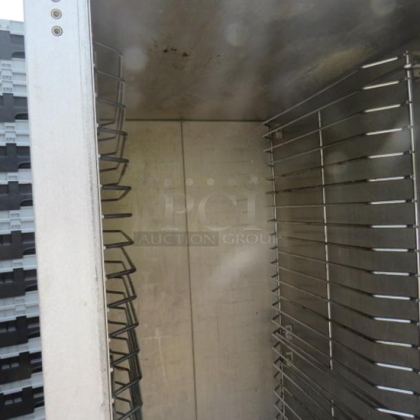 Cozoc Heated Holding/Proofing Cabinet, model HPC7101, dimensions 23x31x67, in working condition, on casters.
