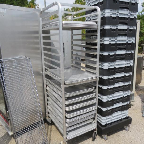Aluminum speed rack on casters, 20.5x26x69 inches, no pans included, used condition. Suitable for commercial kitchens.