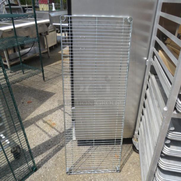 48x18 Metro shelf, wire design, outdoor setting, good condition, no visible markings.