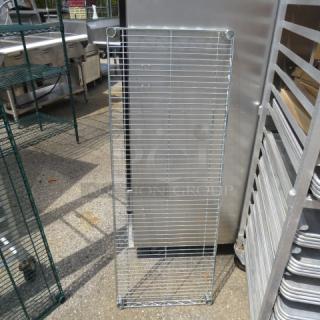 48x18 Metro shelf, wire design, outdoor setting, good condition, no visible markings.