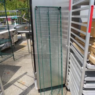 Green Metro shelf, 60x14 inches, sturdy wire construction. Appears in good condition, suitable for storage use.