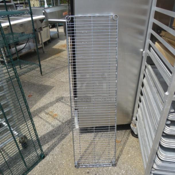 48x14 Metro shelf in good condition, metal construction, vertical orientation, suitable for storage or display spaces.