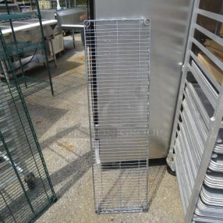 48x14 Metro shelf in good condition, metal construction, vertical orientation, suitable for storage or display spaces.